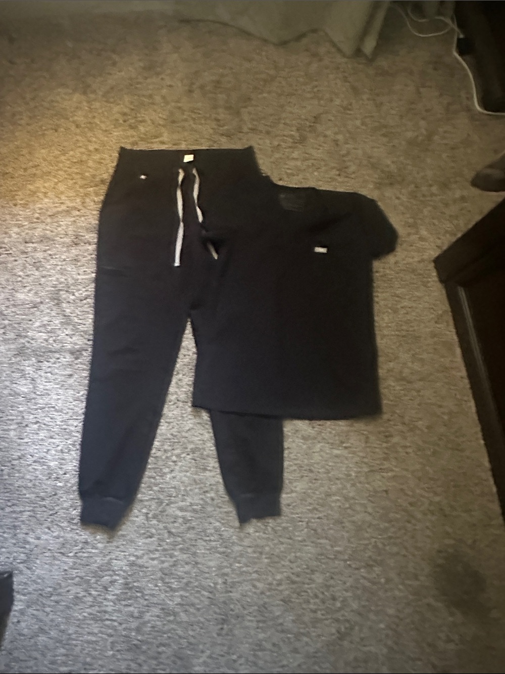 Small black joggers along with XS top